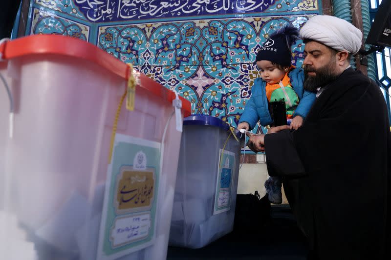 FILE PHOTO: Iranians vote during parliamentary elections at a polling station in Tehran