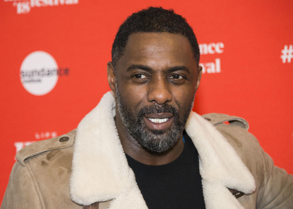 CORRECTS DATE OF AWARD SHOW TO SUNDAY, INSTEAD OF NEXT MONTH - FILE - In this Jan. 20, 2018, file photo, Director Idris Elba poses during the premiere of "Yardie" at the Ray Theatre during the 2018 Sundance Film Festival in Park City, Utah. Michael B. Jordan, Ben Stiller and Elba are among the first presenters announced Thursday, Jan. 3, 2019, for Sunday's Golden Globe Awards. (Photo by Arthur Mola/Invision/AP, File)