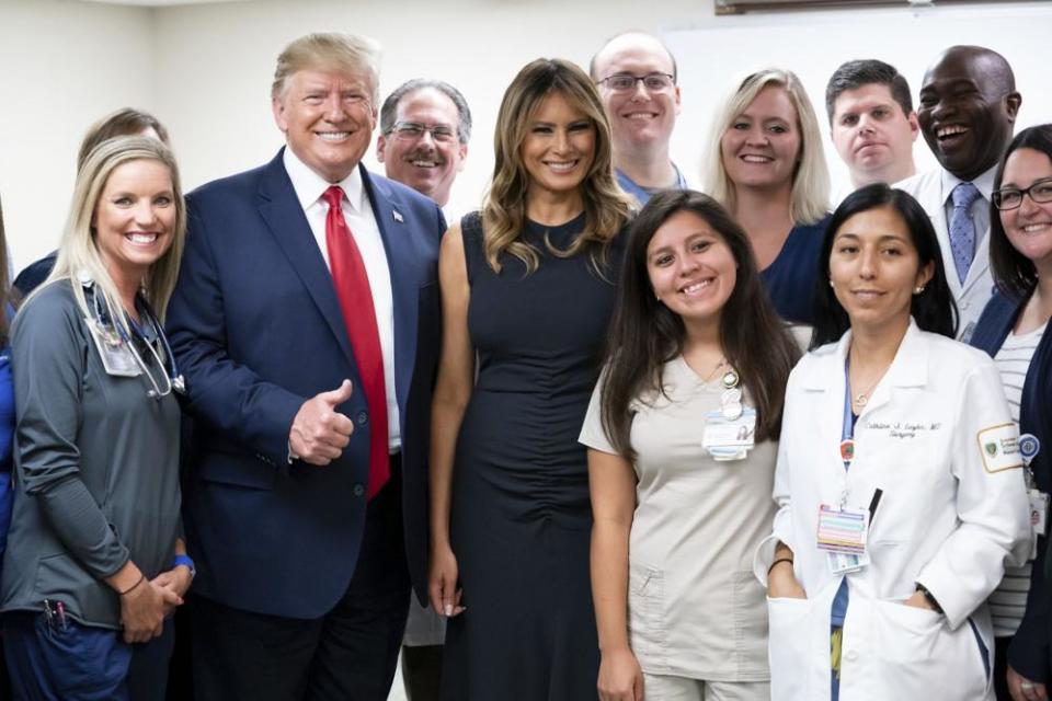 Donald and Melania Trump pose with emergency first responders at Miami Valley Hospital in Dayton.