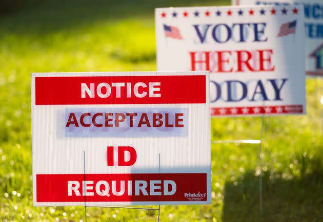 Voter ID signs greet voters in Ruckersville, Virginia, on last November's Election Day. The U.S. Supreme Court announced Wednesday that it will hear a case over the right to defend a voter identification law in North Carolina. (Photo: Bill Clark via Getty Images)