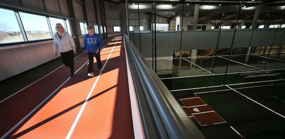 Residents of Nevada enjoy walking on the track of the newly open Nevada Field House on Thursday, Feb. 15, 2024, in Nevada, Iowa.