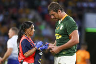 iSouth Africa's Eben Etzebeth receives treatment during the Rugby Championship test match between the Springboks and the Wallabies in Brisbane, Australia, Saturday, Sept. 18, 2021. (AP Photo/Tertius Pickard)