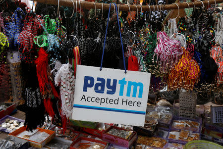 FILE PHOTO: An advertisement of Paytm, a digital wallet company, is pictured at a road side stall in Kolkata, India, January 25, 2017. REUTERS/Rupak De Chowdhuri/File photo