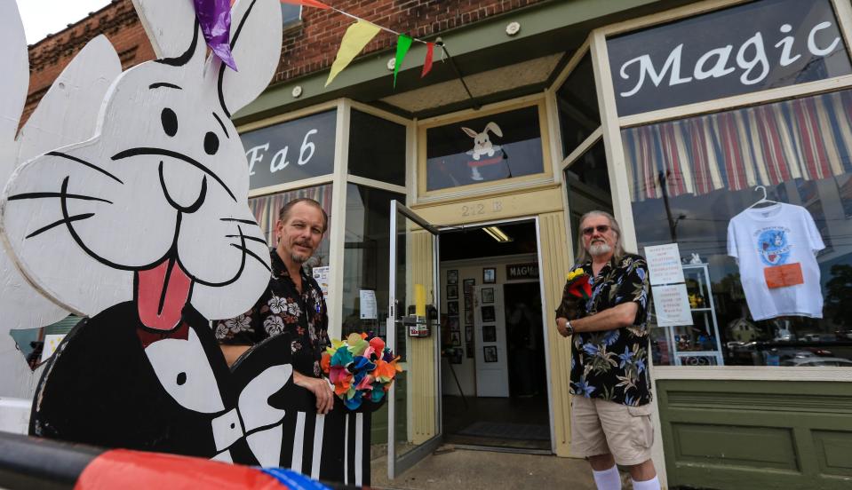 Fab magic owner Rick Fisher, left, and magician Krag Ryal pose for a photo outside of the business in downtown Colon on Thursday Aug. 8, 2013.