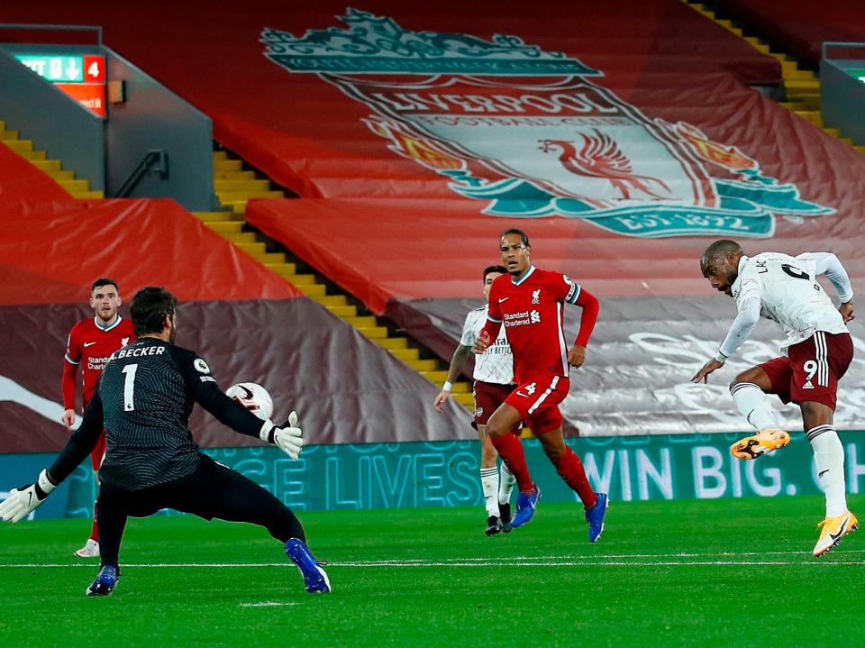 Alisson Becker saves from Alexandre Lacazette (POOL/AFP via Getty Images)