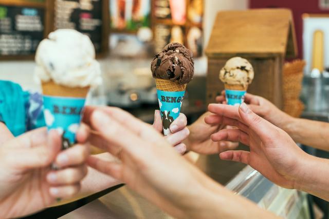 Ben &amp; Jerry's Singapore - Hands reaching out to receive ice-cream cones