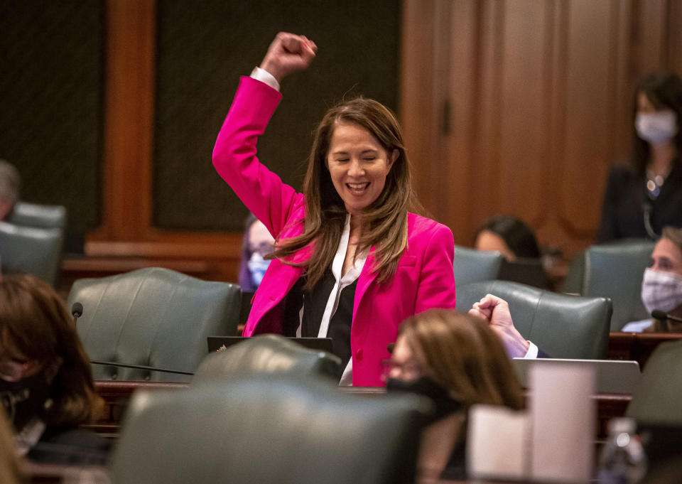 Illinois State Rep. Jennifer Gong-Gershowitz, D-Glenview, celebrates passage of a bill that requires public schools to teach Asian American history, on the floor of the Illinois House of Representatives in Springfield, Ill., on May 31, 2021.<span class="copyright">Justin L. Fowler—State Journal-Register/AP</span>