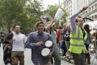 In this Sept. 17, 2011 file photo, a man beats a pair of bongo drums as demonstrators affiliated with the Occupy Wall Street movement gather to call for the occupation of Wall Street in New York. Monday, Sept. 17, 2012 marks the one-year anniversary of the Occupy Wall Street movement. (AP Photo/Frank Franklin II, File)