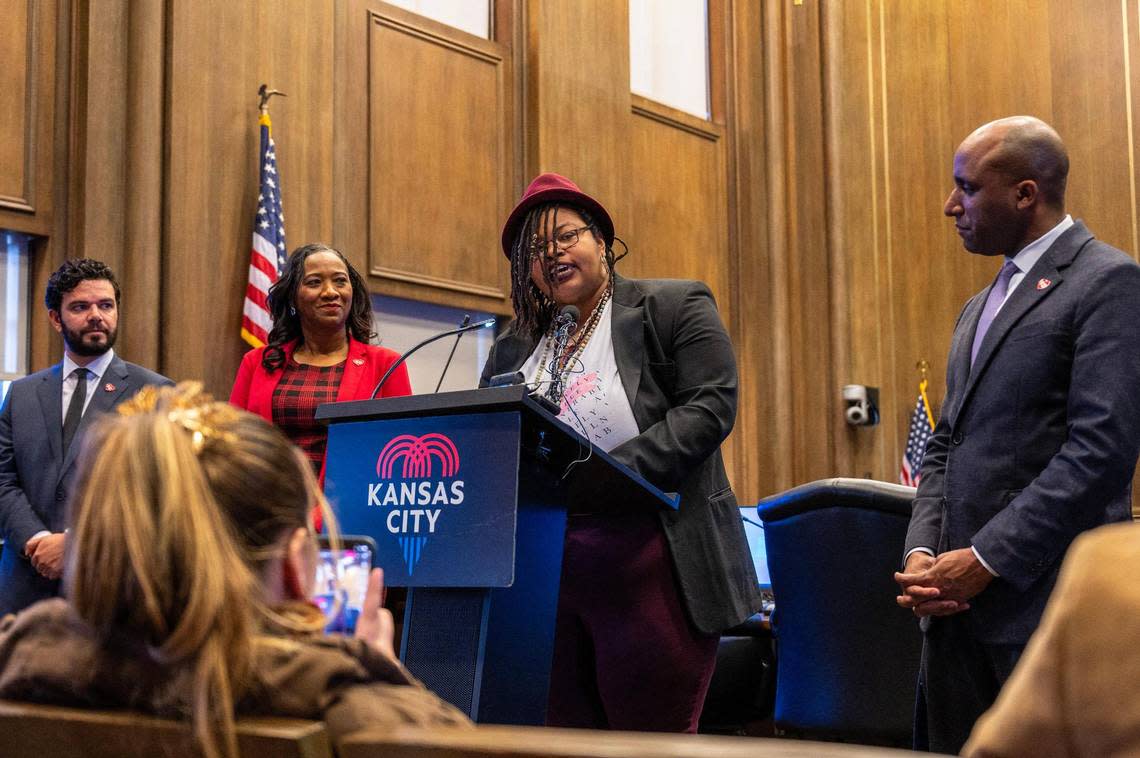 Flanked by, from left, City Council members Jonathan Duncan and Ryana Parks-Shaw and Kansas City Mayor Quinton Lucas, right, Melissa Ferrer Civil recited a poem the day she was named as the city’s new poet laureate in KC Council chambers.