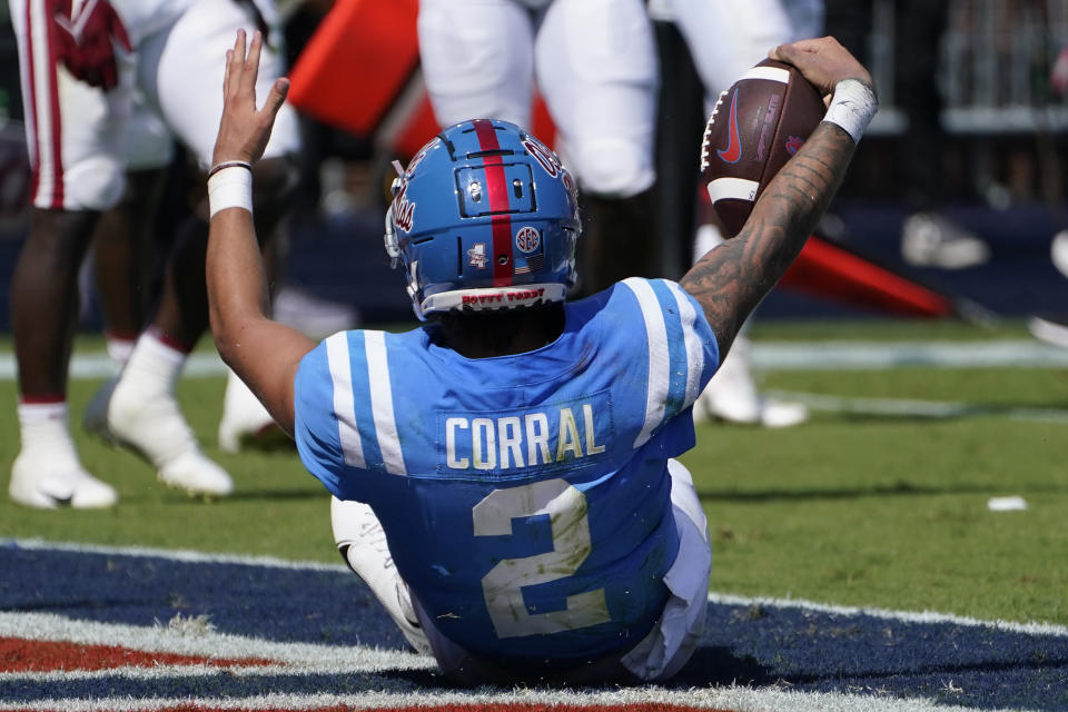 Mississippi quarterback Matt Corral (2) celebrates his seven-yard touchdown run against Arkansas during the first half of an NCAA college football game, Saturday, Oct. 9, 2021, in Oxford, Miss. (AP Photo/Rogelio V. Solis)