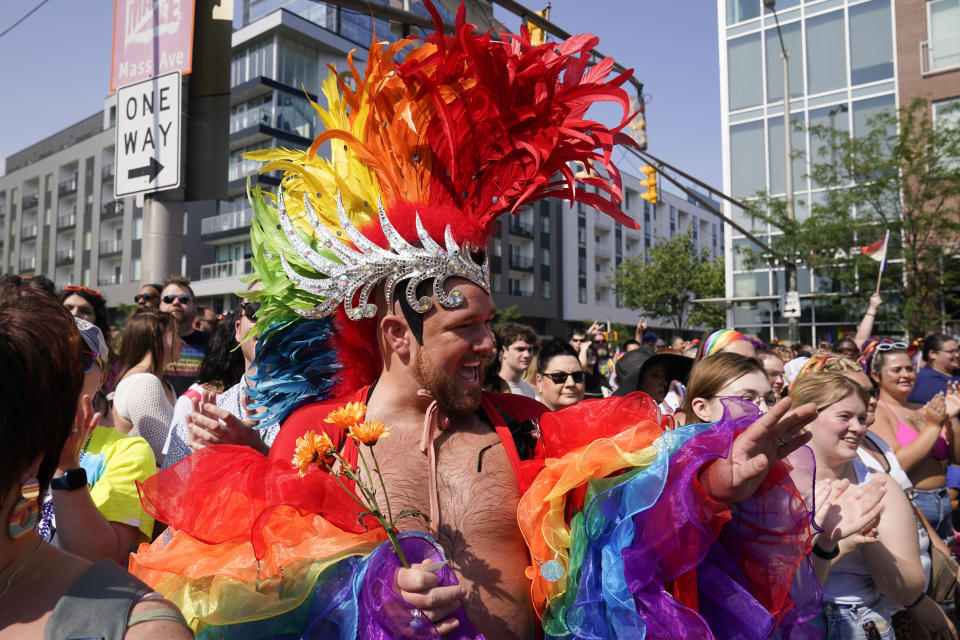 John-Michael Riggs waves during the Pride Parade, Saturday, June 10, 2023, in Indianapolis. (AP Photo/Darron Cummings)