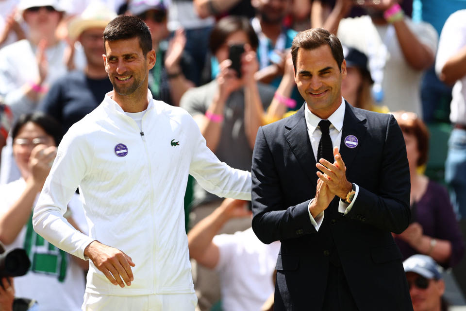 Novak Djokovic and Roger Federer, pictured here during the parade of champions at Wimbledon.