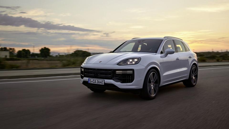 front three quarters view of 2024 porsche cayenne turbo e hybrid driving