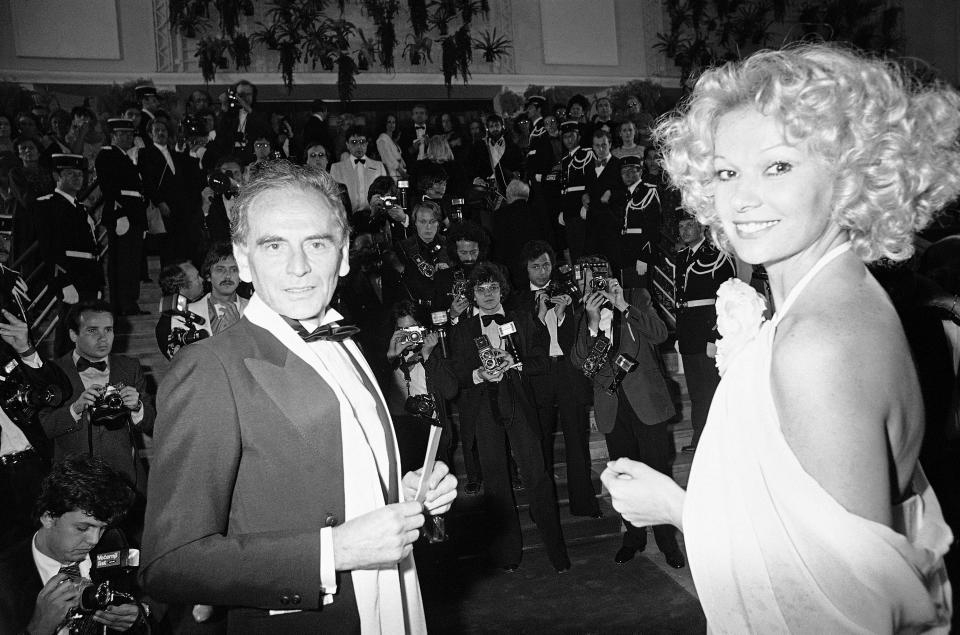 FILE - In this May 19, 1979 file photo, French fashion designer Pierre Cardin and escort arrive at the Cannes Festival Palace to see Coppola's "Apocalyplse Now," in Cannes, southern France. France's Academy of Fine Arts says Pierre Cardin, the French designer whose Space Age style was among the iconic looks of 20th-century fashion, has died at 98. (AP Photo/Jean-Jacques Levy, File)