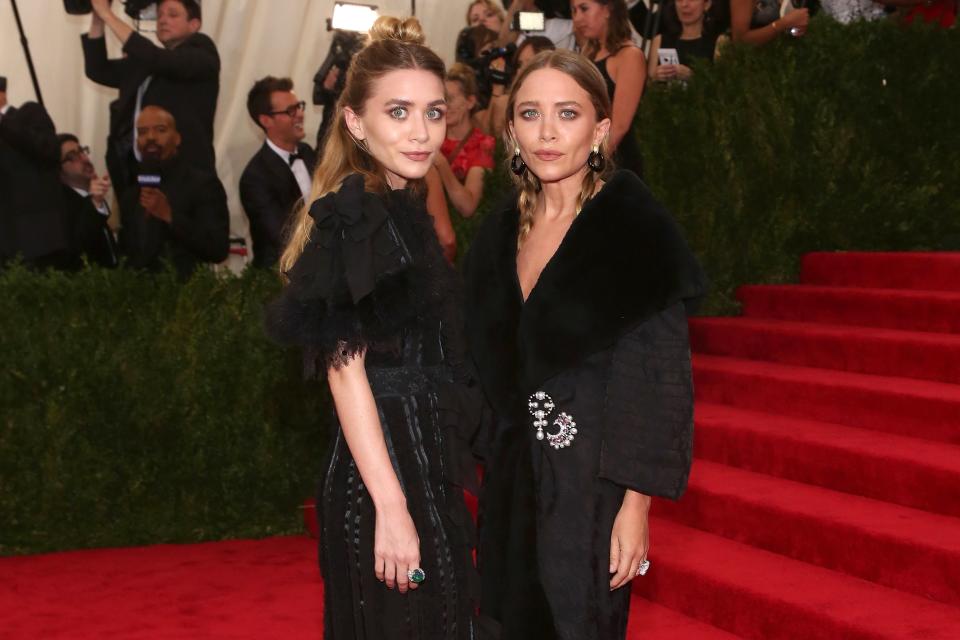 Mary-Kate and Ashley Olsen were bridesmaids in their friend's wedding, and the photographic proof is too perfect for words.