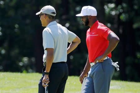 U.S. President Barack Obama and NBA basketball player Chris Paul of the Los Angeles Clippers play golf at Farm Neck Golf Club during Obama's annual summer vacation on Martha's Vineyard, in Oak Bluffs, Massachusetts, U.S. August 7, 2016. REUTERS/Jonathan Ernst