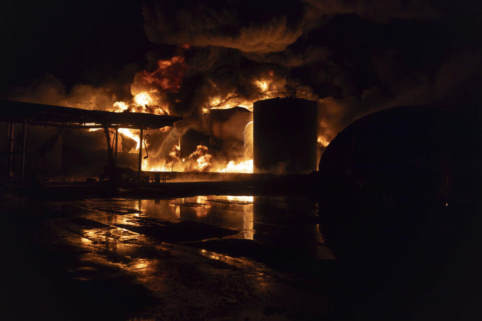 A gas station is seen on fire after a Russian attack on a residential neighborhood in Kharkiv, Ukraine Saturday, Feb. 10, 2024. (AP Photo/Yevhen Titov)