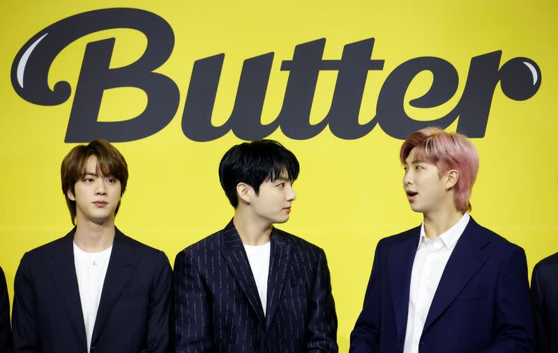 K-pop boy band BTS member RM, Jung Kook and Jin pose for photographs during a photo opportunity promoting their new single 'Butter' in Seoul