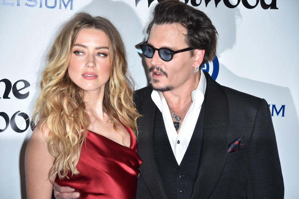 CULVER CITY, CA - JANUARY 09:  Amber Heard and Johnny Depp attend the Art of Elysium 2016 HEAVEN Gala presented by Vivienne Westwood & Andreas Kronthaler at 3LABS on January 9, 2016 in Culver City, California.  (Photo by George Pimentel/WireImage)