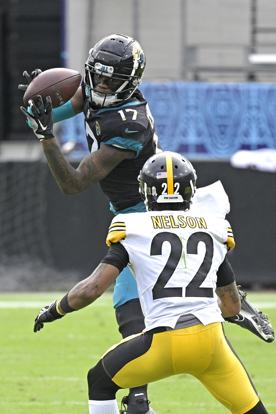 Jacksonville Jaguars wide receiver DJ Chark Jr. (17) makes a reception in front of Pittsburgh Steelers cornerback Steven Nelson (22) during the first half of an NFL football game, Sunday, Nov. 22, 2020, in Jacksonville, Fla. (AP Photo/Phelan M. Ebenhack)