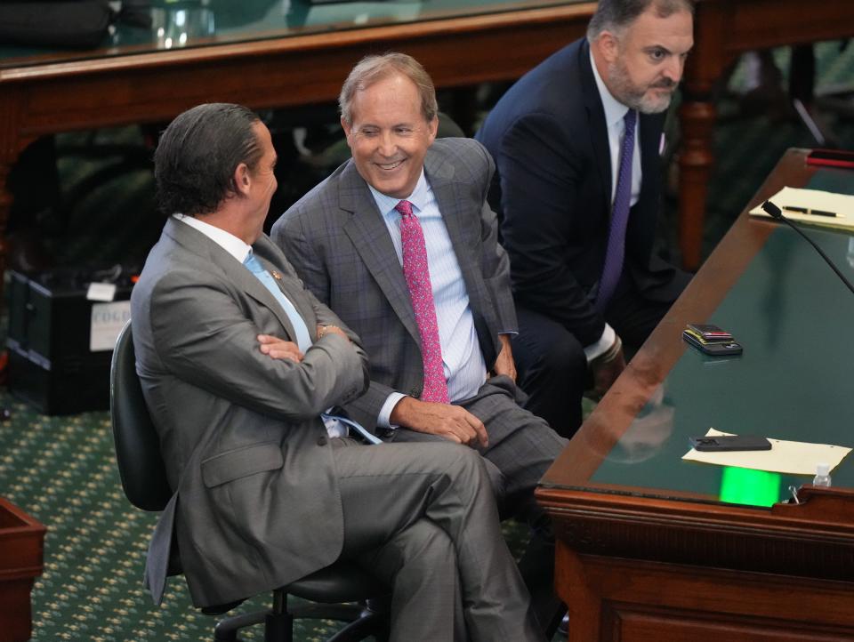 Attorney General Ken Paxton, middle, shown at his impeachment trial with his attorneys Tony Buzbee, left, and Mitch Little, says he'll campaign against three fellow Republicans in the Texas House who backed his impeachment.