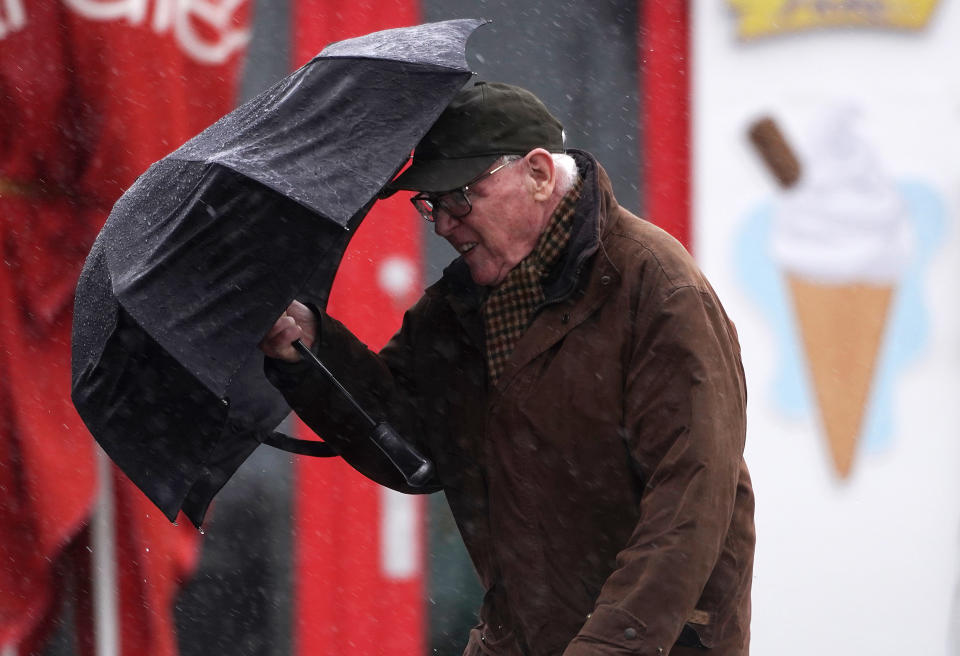 A man struggles against strong wind in Clontarf, Dublin, as Storm Dudley makes it's way over Ireland. The storm is to be followed closely by Storm Eunice, which will bring strong winds and the possibility of snow late Thursday and into Friday. Picture date: Wednesday February 16, 2022.