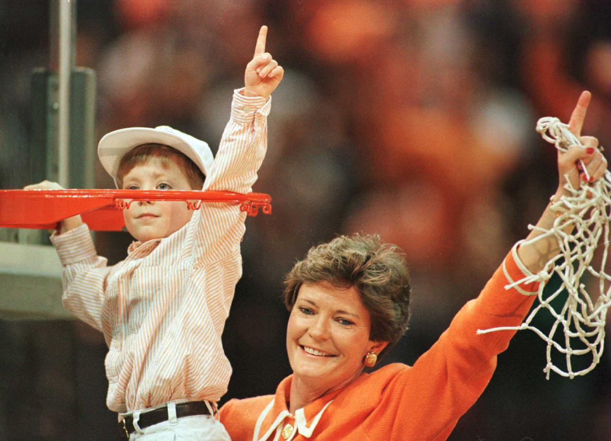 It became a tradition for Summitt to cut down the nets with her son, Tyler, as she did here in 1996 after the Lady Volunteers defeated Georgia in the NCAA championship game. (Photo by Matthew Stockman/Getty Images)