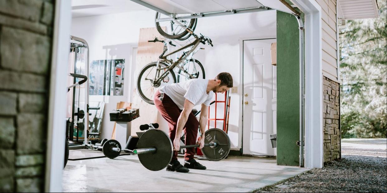 man doing exercise workout in garage, bone health for cyclists