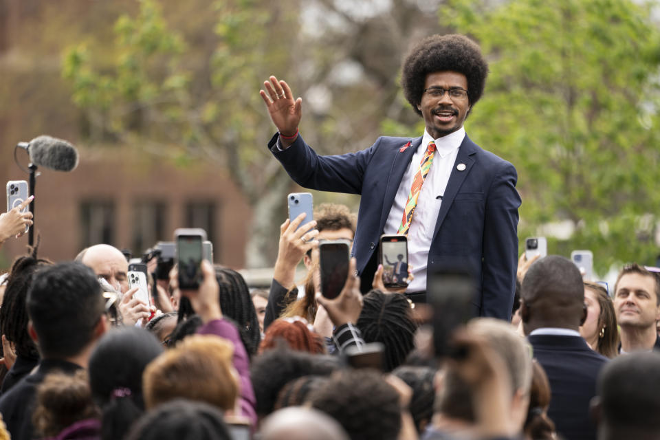 FILE - Expelled Rep. Justin Pearson waves, Friday, April 7, 2023, in Nashville, Tenn., the day after Pearson and another member of the Tennessee State Legislature were expelled. Two young Black Tennessee state legislator Justin Pearson and Justin Jones — now widely known simply as "the Justins" — were expelled by the overwhelmingly white, Republican-controlled state Legislature and then reinstated by local officials days later. They are being heralded as living echoes of the civil rights struggles of the 1960s, when leaders like the Rev. Martin Luther King Jr., John Lewis and A. Philip Randolph organized protests across the American South. (AP Photo/George Walker IV, File)