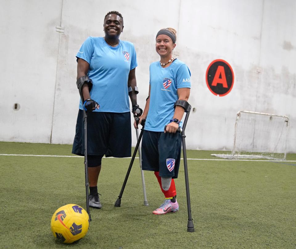 LaQuinta Haynes and Katie Bondy pose for a photo during practice at TOCA in Lewis Center. Both central Ohio women are part of the U.S. Women's National Amputee Soccer Team that will compete in the Amp Futbol Cup in Warsaw, Poland.