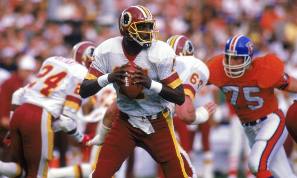 <span>Doug Williams played in a time when the vast majority of quarterbacks were white. </span><span>Photograph: Rick Stewart/Getty Images</span>