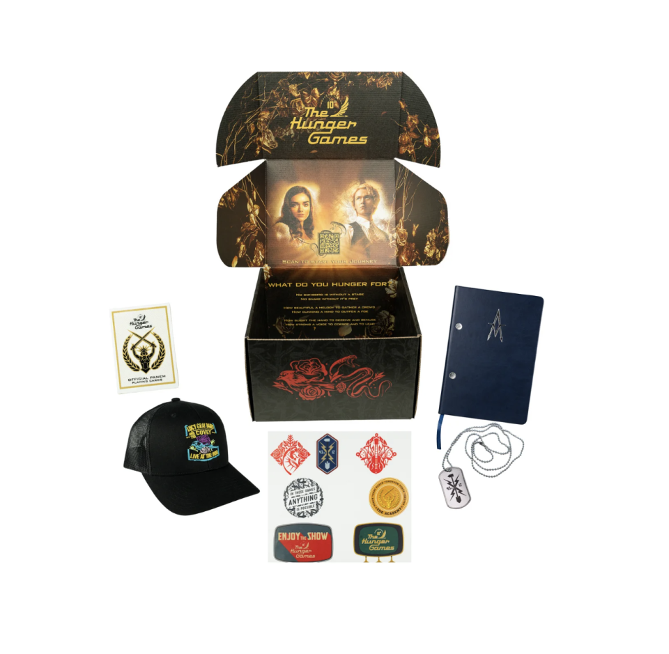 black box with hunger games collectables