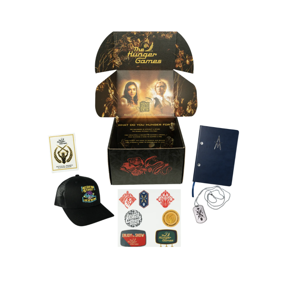 A black box of Hunger Games collectibles.