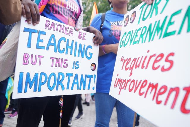 Members of the National Education Union (NEU) take part in a rally in July. 