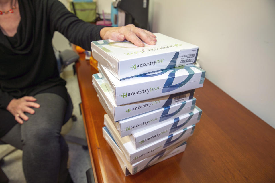 Lauren Gilbert, senior manager for public services for the Center for Jewish History, handles Ancestry DNA test kits the center offers free to Holocaust survivors, Tuesday, Nov. 29, 2022, in New York. (AP Photo/Ted Shaffrey)