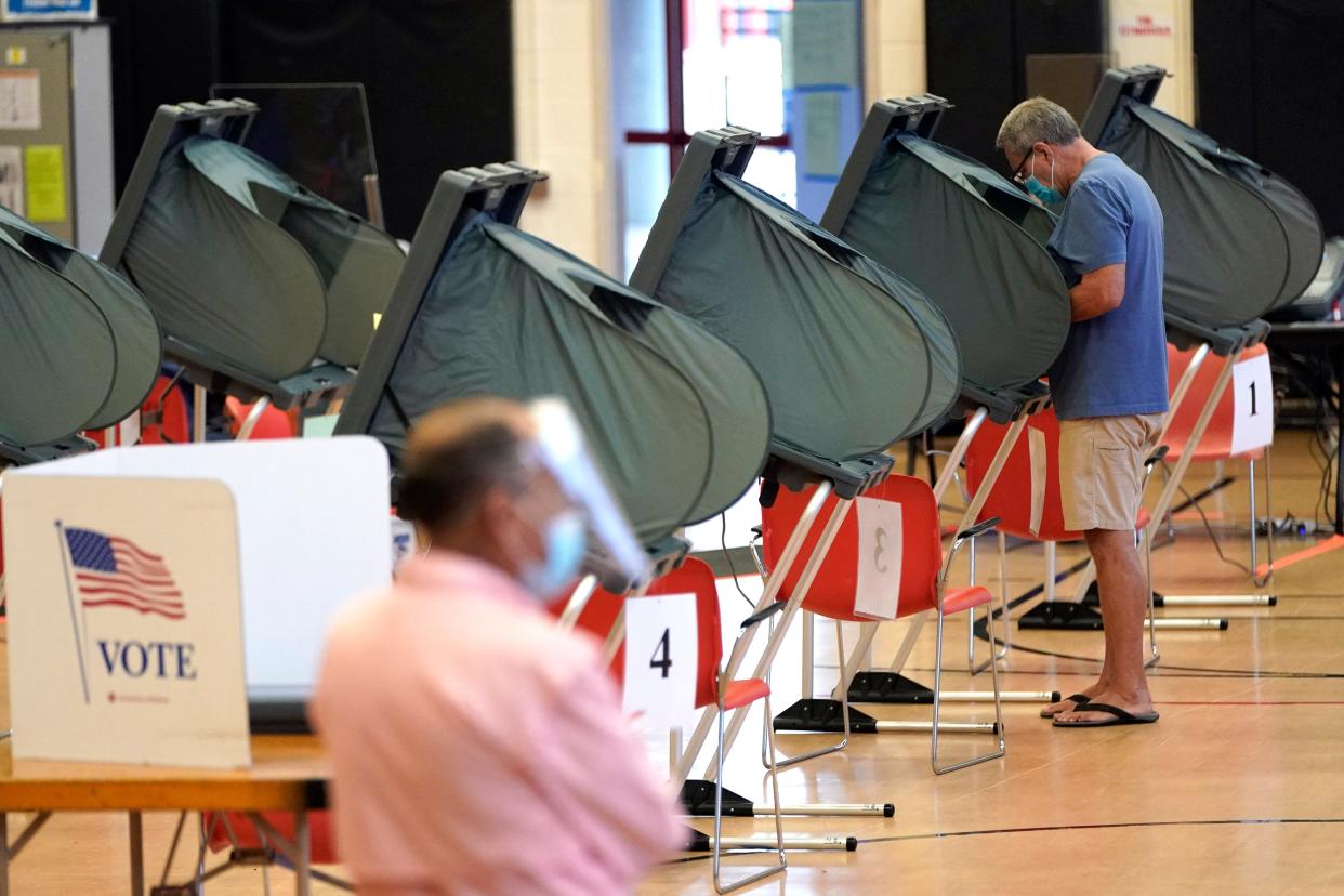 A voter casts their ballot in Houston, Texas, in June 2020.