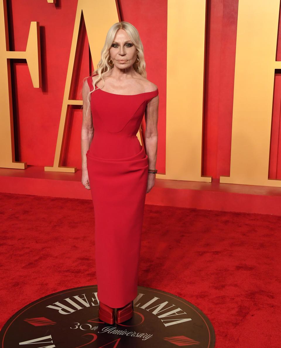 Image may contain: Donatella Versace, Fashion, Adult, Person, Premiere, Red Carpet, Formal Wear, Clothing, and Dress