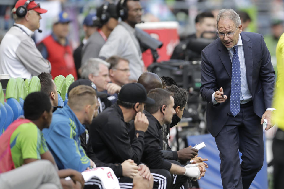 FILE - In this Oct. 6, 2019, file photo, Seattle Sounders head coach Brian Schmetzer, right, talks to his bench during the second half of an MLS soccer match against Minnesota United in Seattle. The MLS soccer team announced Monday, Jan. 25, 2021, that the team and Schmetzer had reached agreement on a multiyear contract extension. (AP Photo/Ted S. Warren, File)