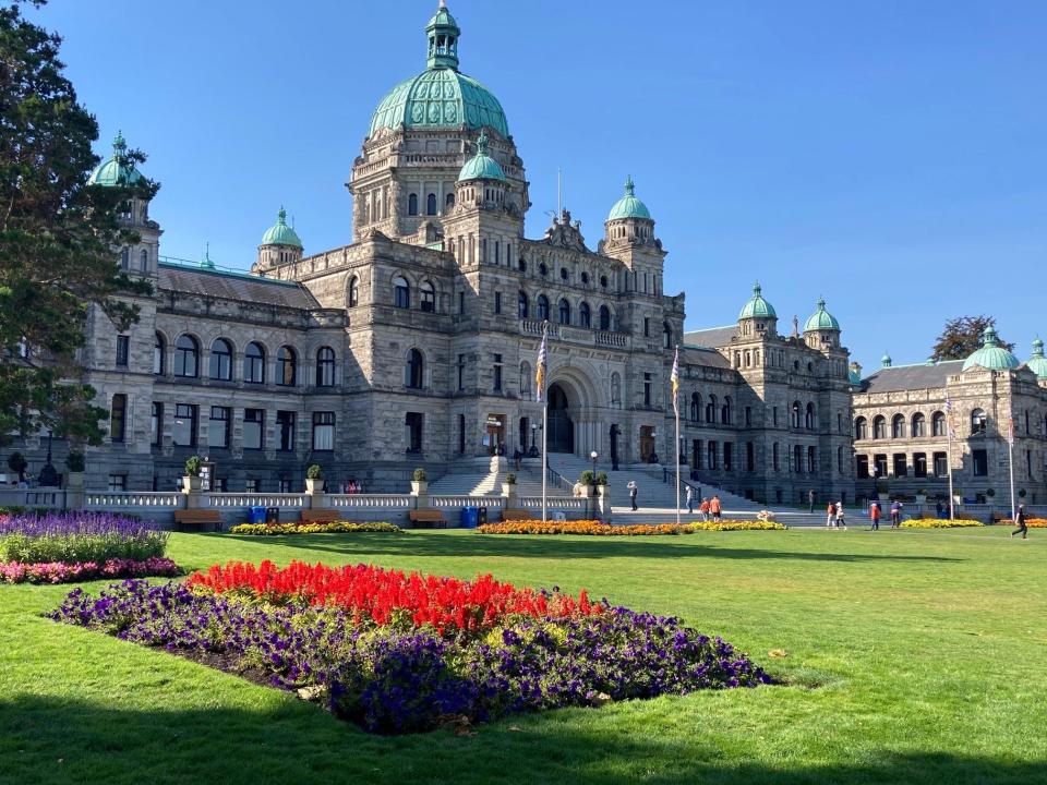 Flower gardens accentuate the British Columbia legislative buildings.