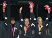 (L to R) Ibtihaj Muhammad, Dagmara Wozniak and Mariel Zagunis of the USA celebrate their gold medal in team sabre during the Guadalajara 2011 Pan American Games, in Guadalajara, Mexico, on October 28, 2011.AFP PHOTO/OMAR TORRES (Photo credit should read OMAR TORRES/AFP/Getty Images)