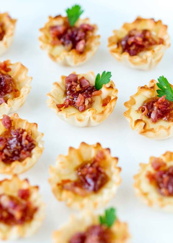 <p>Pizzazerie</p><p>If you love baked brie, and you’re looking for an easy appetizer idea, you will love these baked brie bites with fig jam and crispy prosciutto!</p><p><strong>Get the recipe: <a href="https://pizzazzerie.com/recipes/baked-brie-bites-recipe/" rel="nofollow noopener" target="_blank" data-ylk="slk:Baked Brie Phyllo Bites;elm:context_link;itc:0;sec:content-canvas" class="link rapid-noclick-resp"><em>Baked Brie Phyllo Bites</em></a></strong></p>