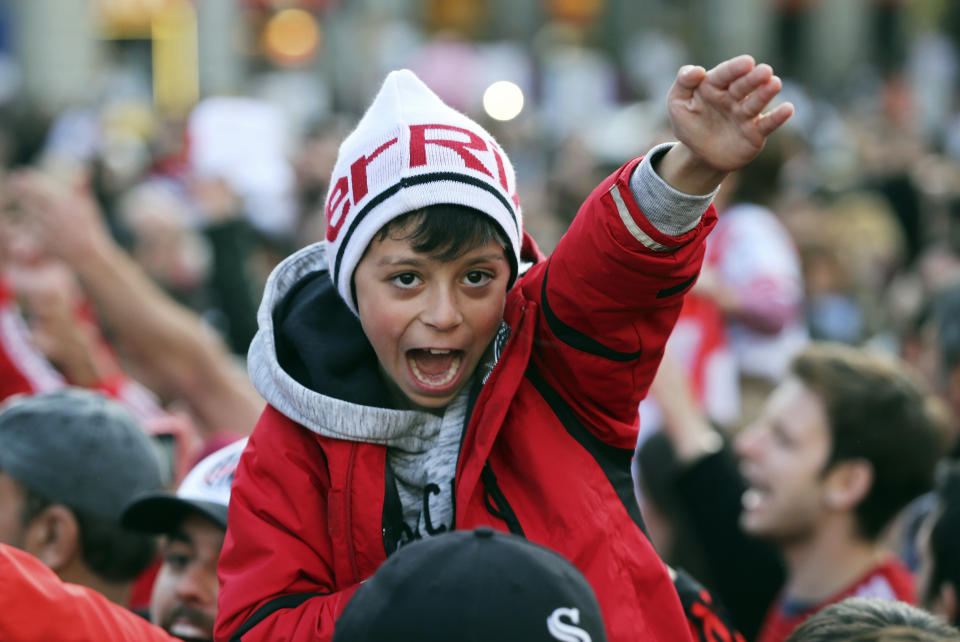 River Plate supporters cheer during a gathering at the Puerta del Sol square in Madrid Saturday, Dec. 8, 2018. The Copa Libertadores Final between River Plate and Boca Juniors will be played on Dec. 9 in Madrid, Spain, at Real Madrid's stadium. (AP Photo/Armando Franca)