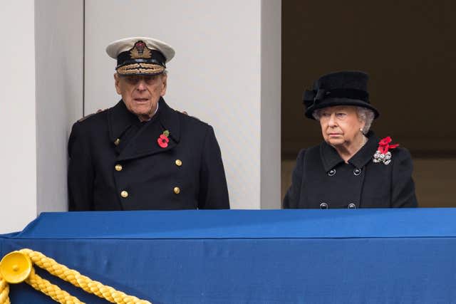 The Queen and the Duke of Edinburgh observing from a balcony during the annual Remembrance Sunday Service at the Cenotaph memorial in Whitehall, central London, in 2017