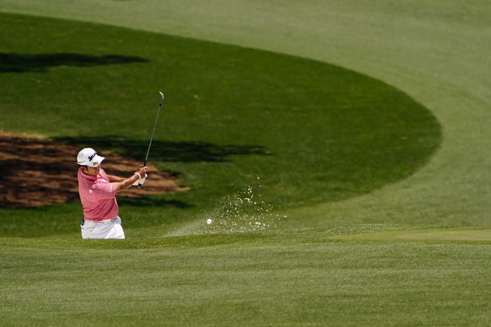 Hideki Matsuyama, of Japan, hits out of a bunker on the 15th hole during a practice round for the Masters golf tournament on Monday, April 4, 2022, in Augusta, Ga. (AP Photo/Matt Slocum)