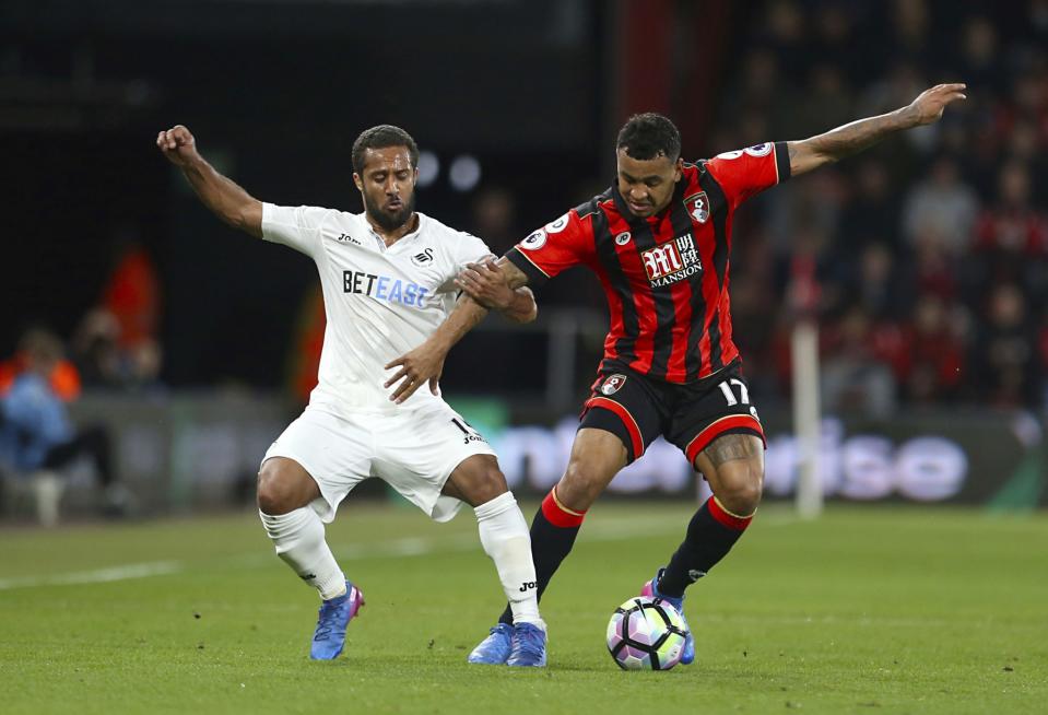 <p>Swansea City’s Wayne Routledge, left, and AFC Bournemouth’s Joshua King battle for the ball during the English Premier League soccer match at the Vitality Stadium </p>