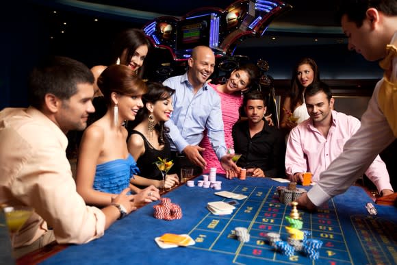 People playing craps in a casino.