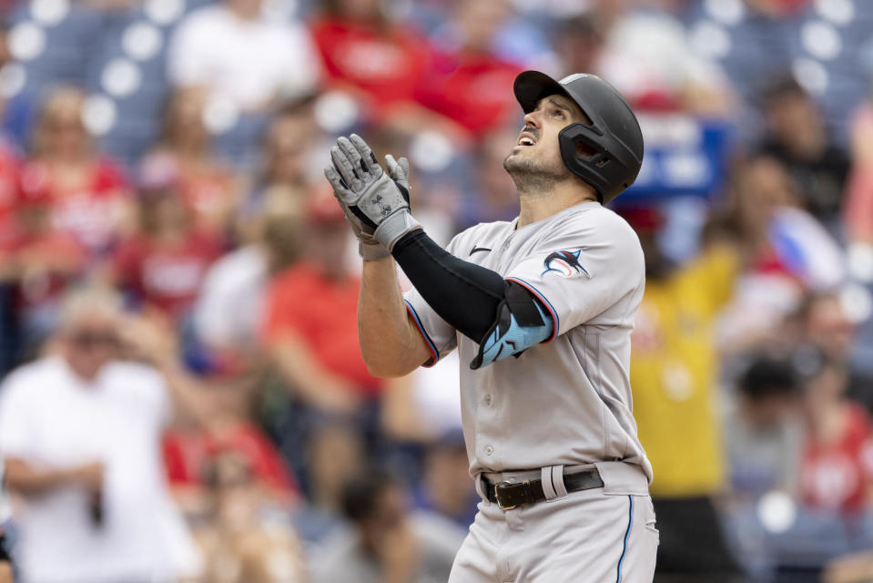 Miami Marlins' Adam Duvall gestures as he approaches home plate after hitting a home run during the third inning of a baseball game against the Philadelphia Phillies, Sunday, July 18, 2021, in Philadelphia. (AP Photo/Laurence Kesterson)