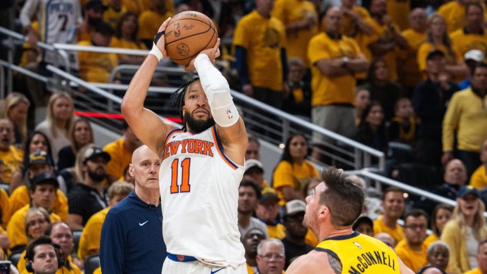 May 17, 2024;  Indianapolis, Indiana, USA;  New York Knicks guard Jalen Brunson (11) shoots the ball while Indiana Pacers guard TJ McConnell (9) defends during game six of the second round of the 2024 NBA playoffs at Gainbridge Fieldhouse.