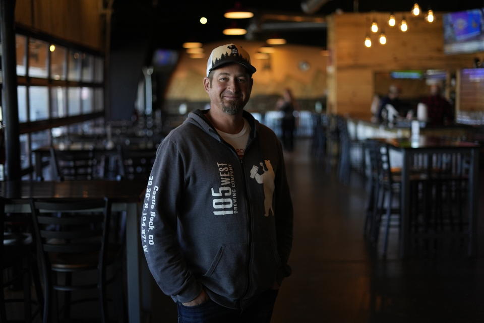 Eric Seufert, owner and manager of 105 West Brewing Co., poses for a photo at his brewery room Tuesday, Oct. 18, 2022, in Castle Rock, Colo. Brewing beer, cooking food, and refilling water bottles with recycled wastewater could soon become standard practice in a state that's synonymous with its pristine-tasting snowmelt and mountain springs. (AP Photo/Brittany Peterson)