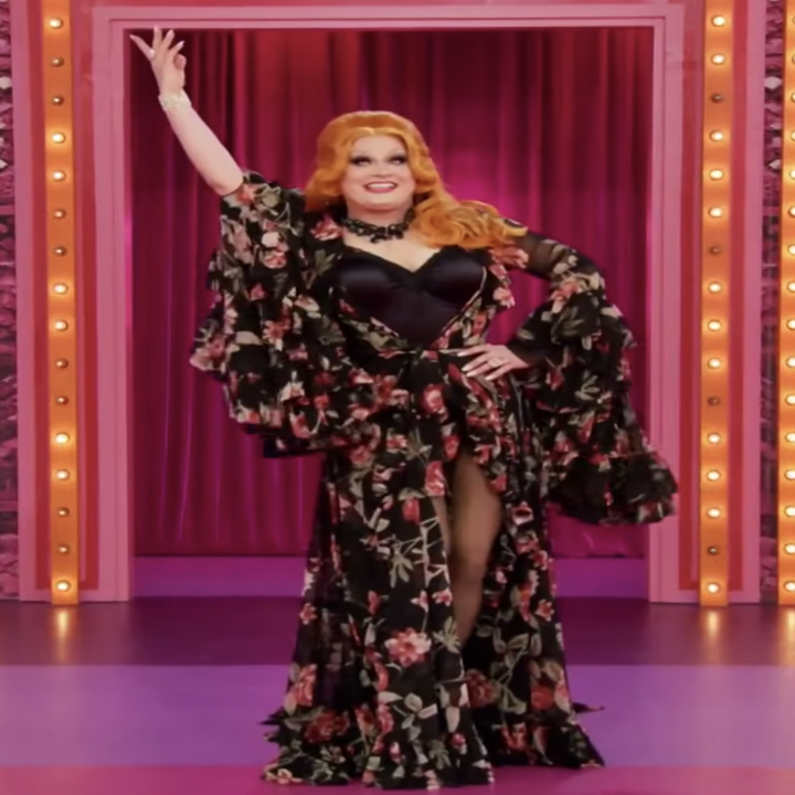 Jinkx Monsoon raising her arm